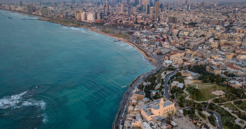 Employer of Record for Tel Aviv Startups: Fast Hiring, Full Compliance 8 Aerial view of Tel Aviv city skyline and Mediterranean coastline for EOR in Tel Aviv startups
