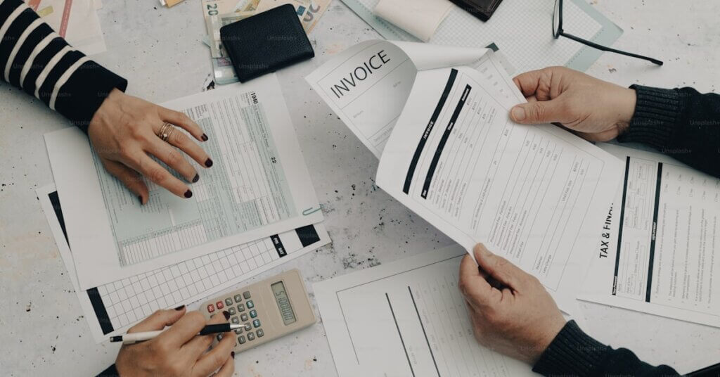 Israel Payroll Services for Foreign Companies: 2026 Full Guide 9 Business professionals reviewing payroll and finance documents for Israel payroll services