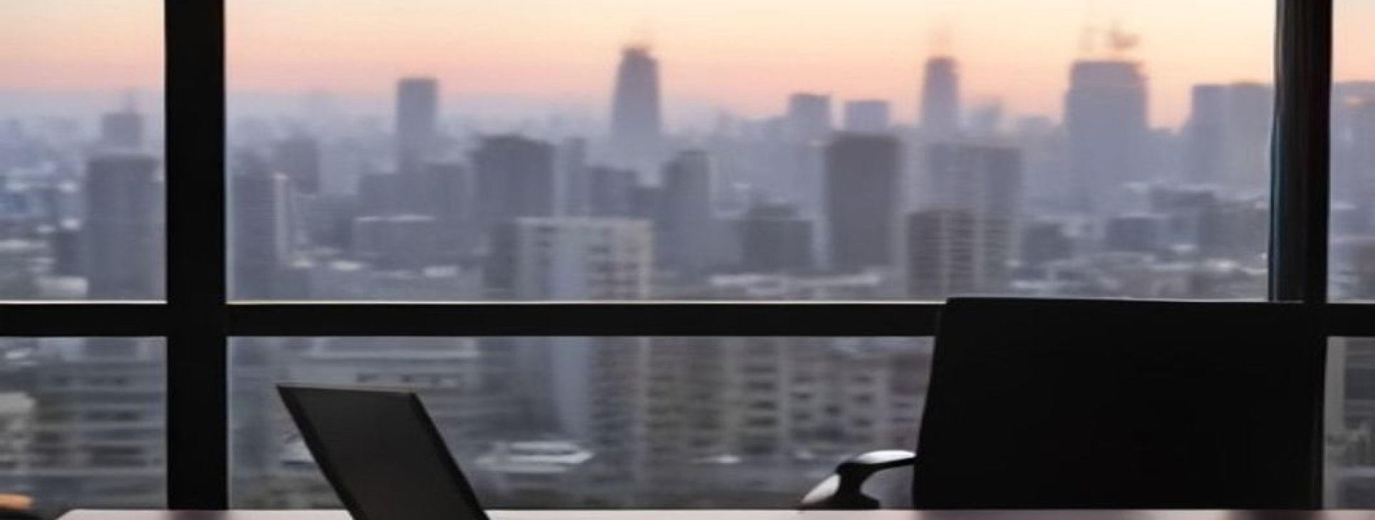 Toshav Chozer Israel returning resident's laptop and desk overlooking the Tel Aviv skyline while keeping a foreign job via EOR